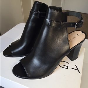 Black leather heeled sandal with ankle strap